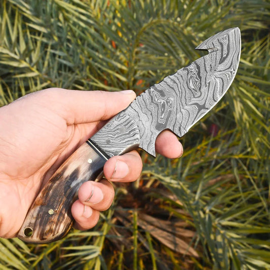Handmade Damascus Steel Gut Hook Hunting Knife – Ram Horn Handle with Leather Sheath | Knives Zone