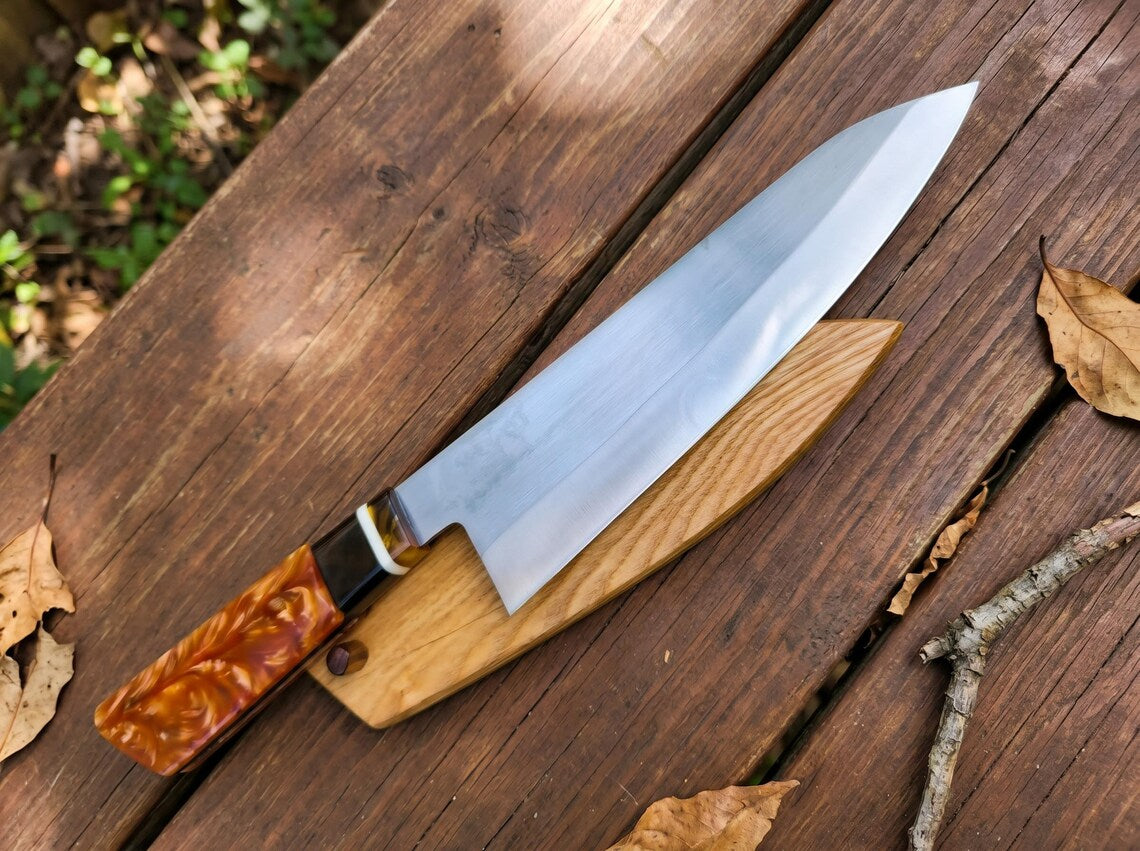 Knife with a wooden handle on a wooden surface
