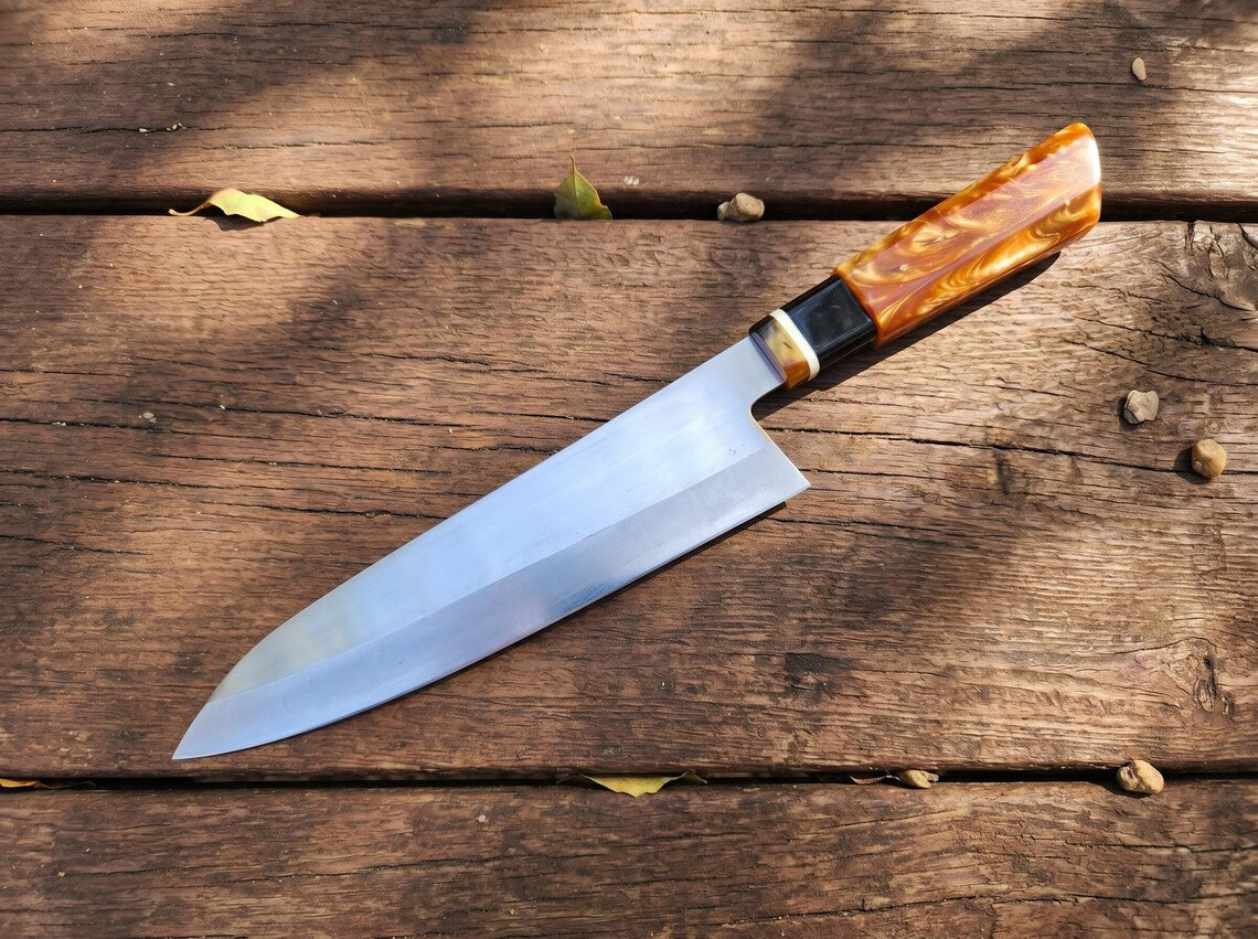 Knife with a wooden handle on a wooden surface